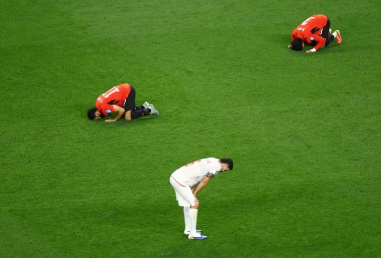 Soccer Football - FIFA World Cup 2026 - Group G - Egypt v Iran - Seattle Stadium, Seattle, Washington, U.S. - June 26, 2026 Egypt's Mohanad Lashin and Egypt's Mohamed Hany celebrate as Iran's Saeid Ezatolahi looks dejected after the match REUTERS/Lisi Niesner