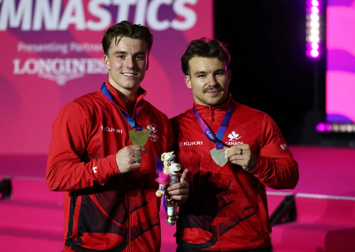 Gold medallist Canada's Felix Dolci celebrates after winning the Men's Pommel Horse Final with silver medallist Canada's William Emard.Matthew Childs