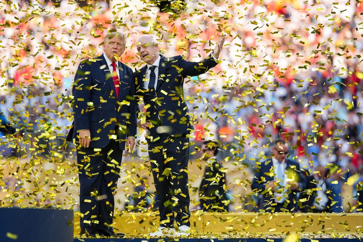 FIFA President Gianni Infantino (right) speaks to U.S. President Donald Trump as they walk offstage after presenting the FIFA World Cup Trophy to Spain on Sunday.Andrew Harnik/Getty Images