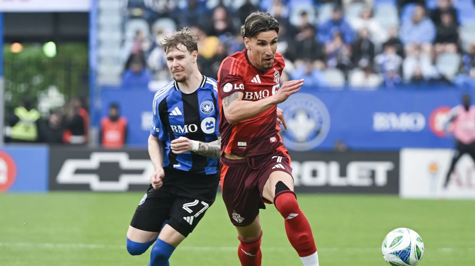 Toronto FC's Theo Corbeanu (7) breaks away from CF Montreal's Dawid Bugaj (27) during second half MLS soccer action in Montreal, Saturday, May 17, 2025. THE CANADIAN PRESS/Graham Hughes(Graham Hughes)