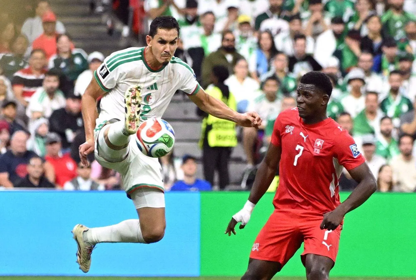 Algeria's Aissa Mandi advances the ball against Switzerland.