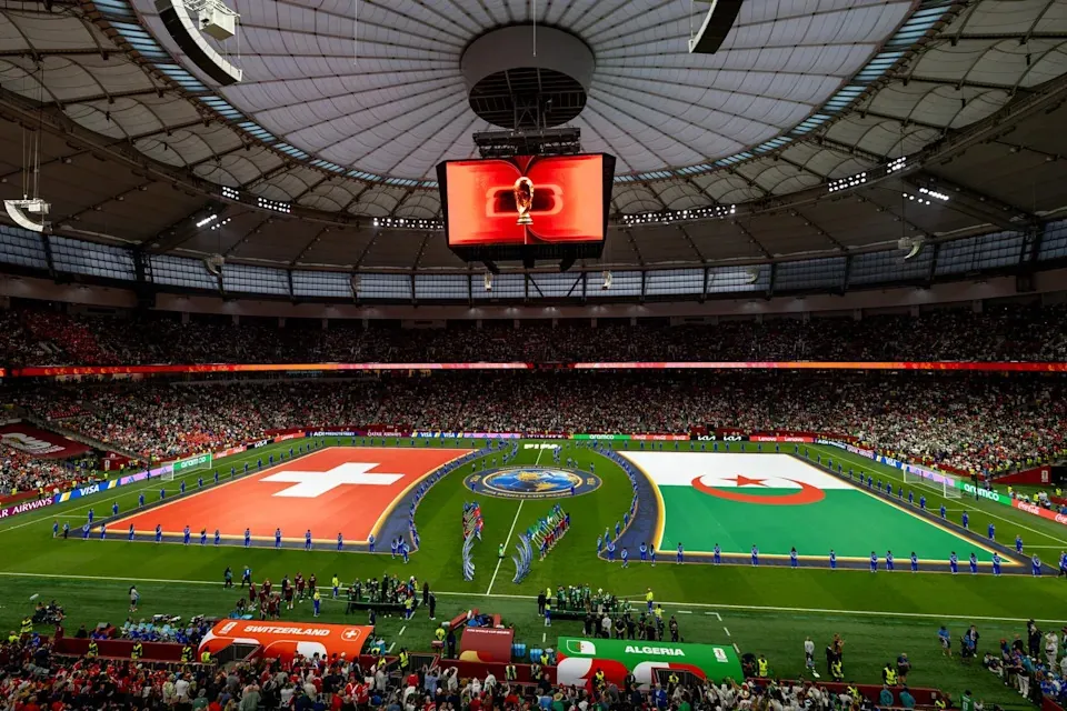 The flags of Switzerland and Algeria are displayed across the field before a World Cup round of 32 match, in Vancouver, on Thursday, July 2, 2026. THE CANADIAN PRESS/Timothy Matwey